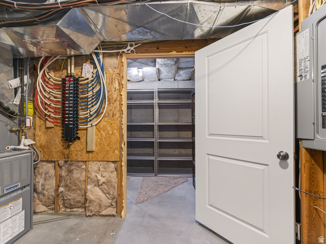 1279 West 1500th Street North Mapleton, UT 84664 - Photo 63 of 83 Utility room featuring a white paneled door, a furnace, and an electrical panel with PEX plumbing