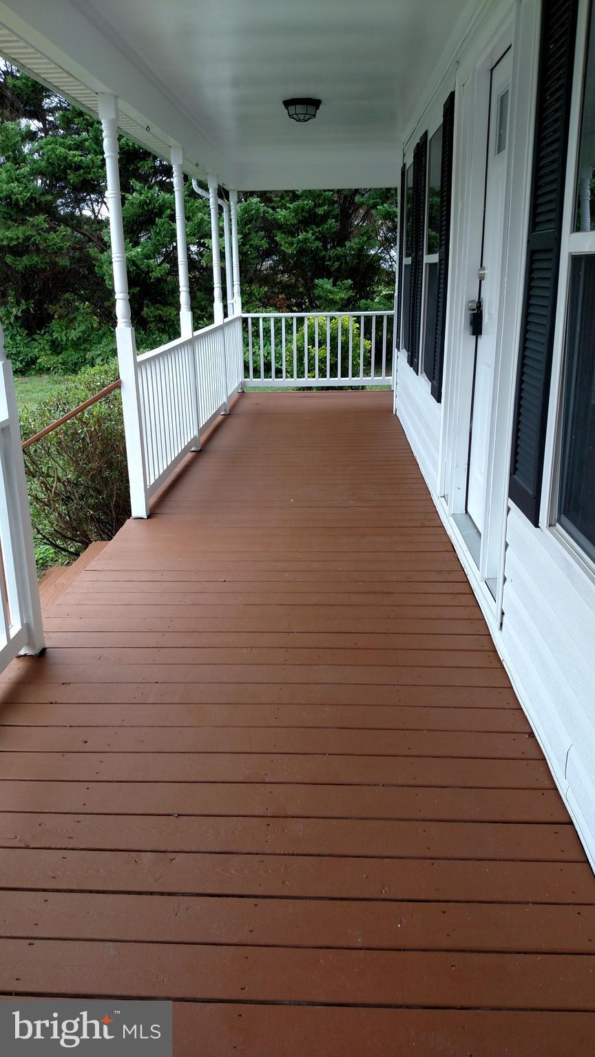 93 Griffith Way Owings, MD 20736 - Photo 2 of 22 a view of a balcony with wooden floor
