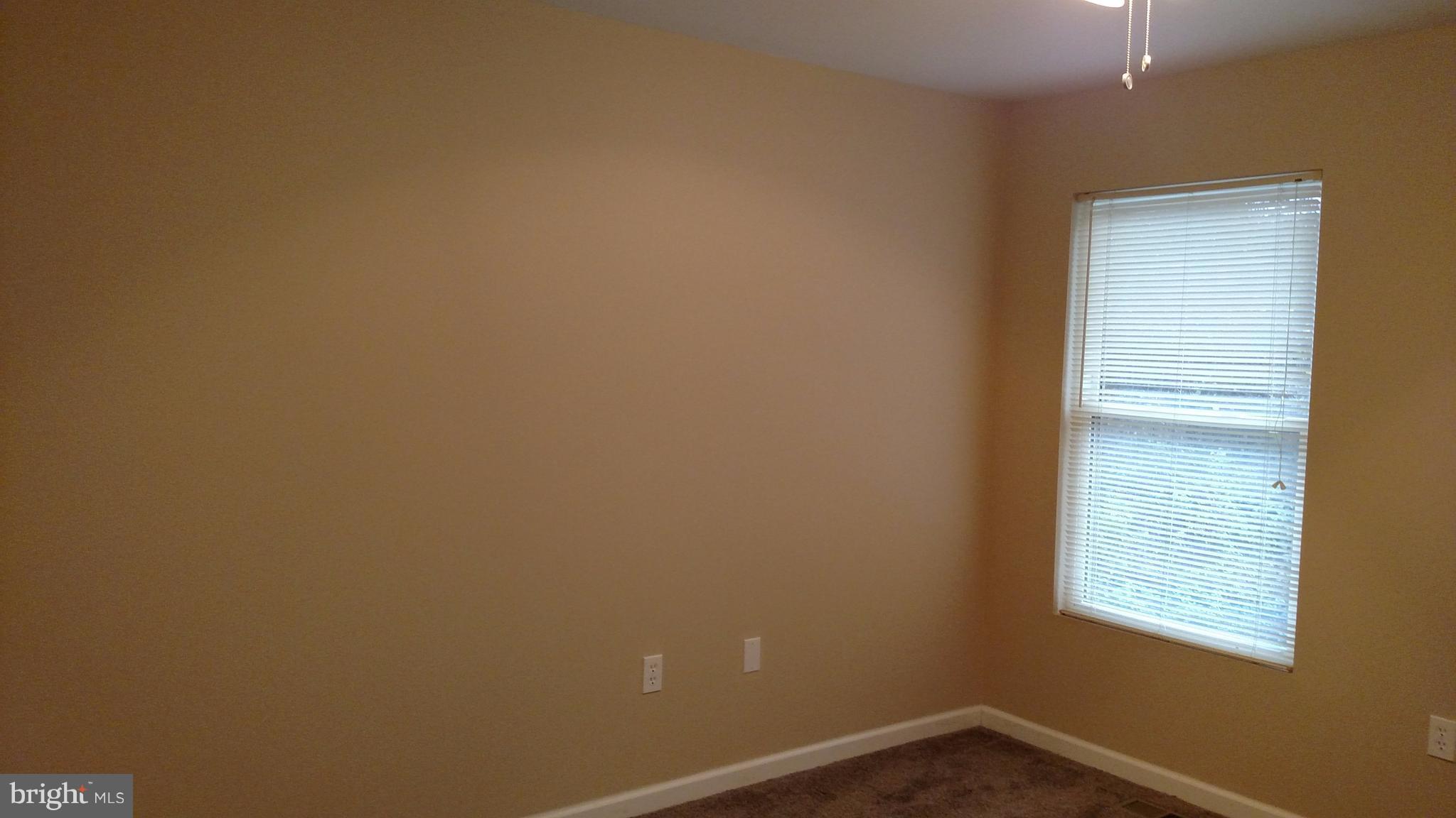 93 Griffith Way Owings, MD 20736 - Photo 19 of 22 a view of an empty room with a window