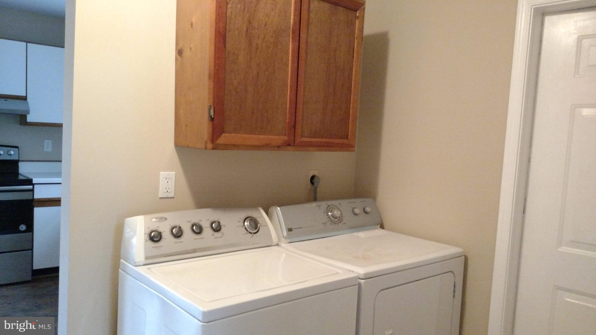 93 Griffith Way Owings, MD 20736 - Photo 20 of 22 a utility room with dryer and washer