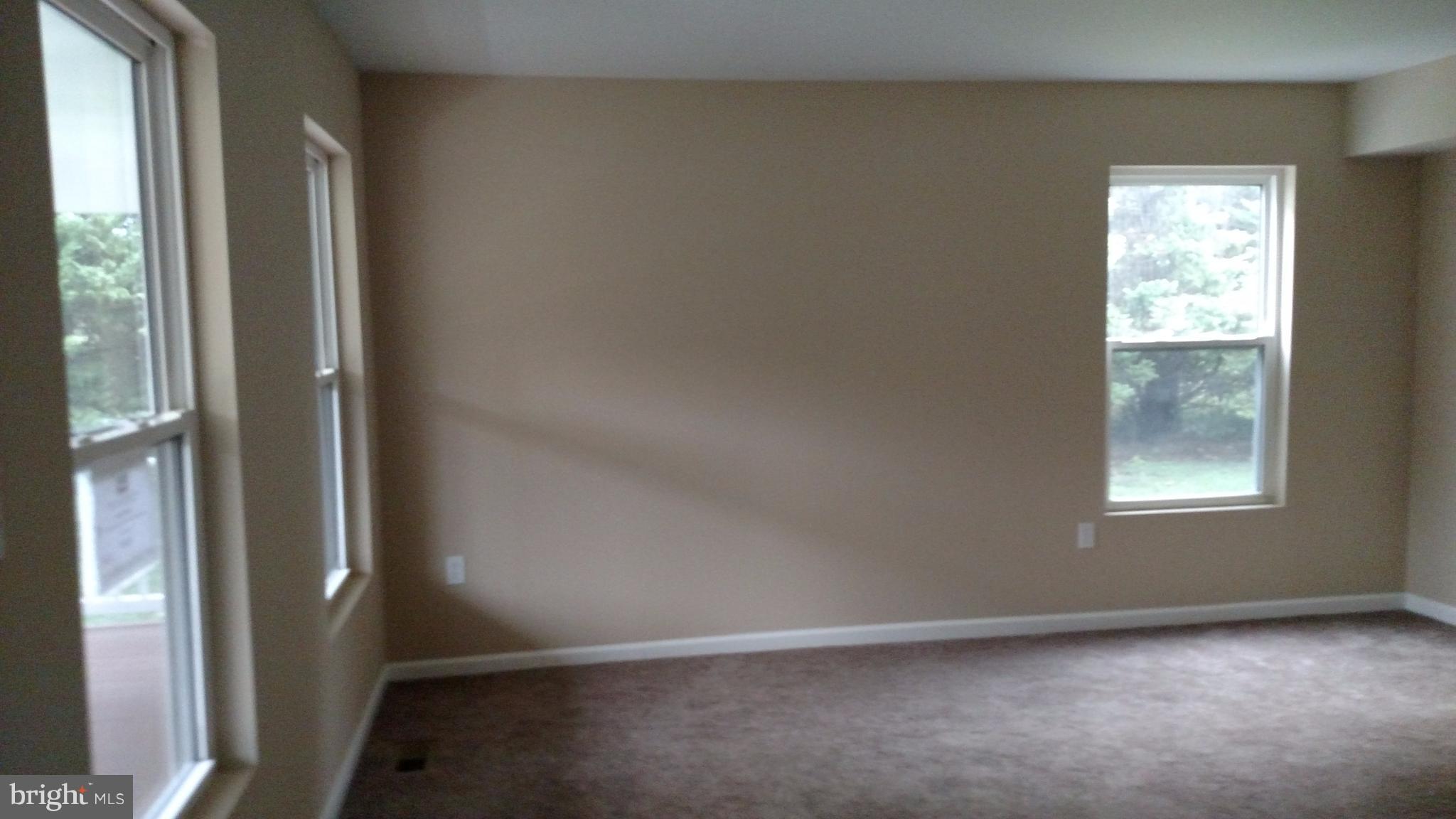 93 Griffith Way Owings, MD 20736 - Photo 22 of 22 an empty room with windows