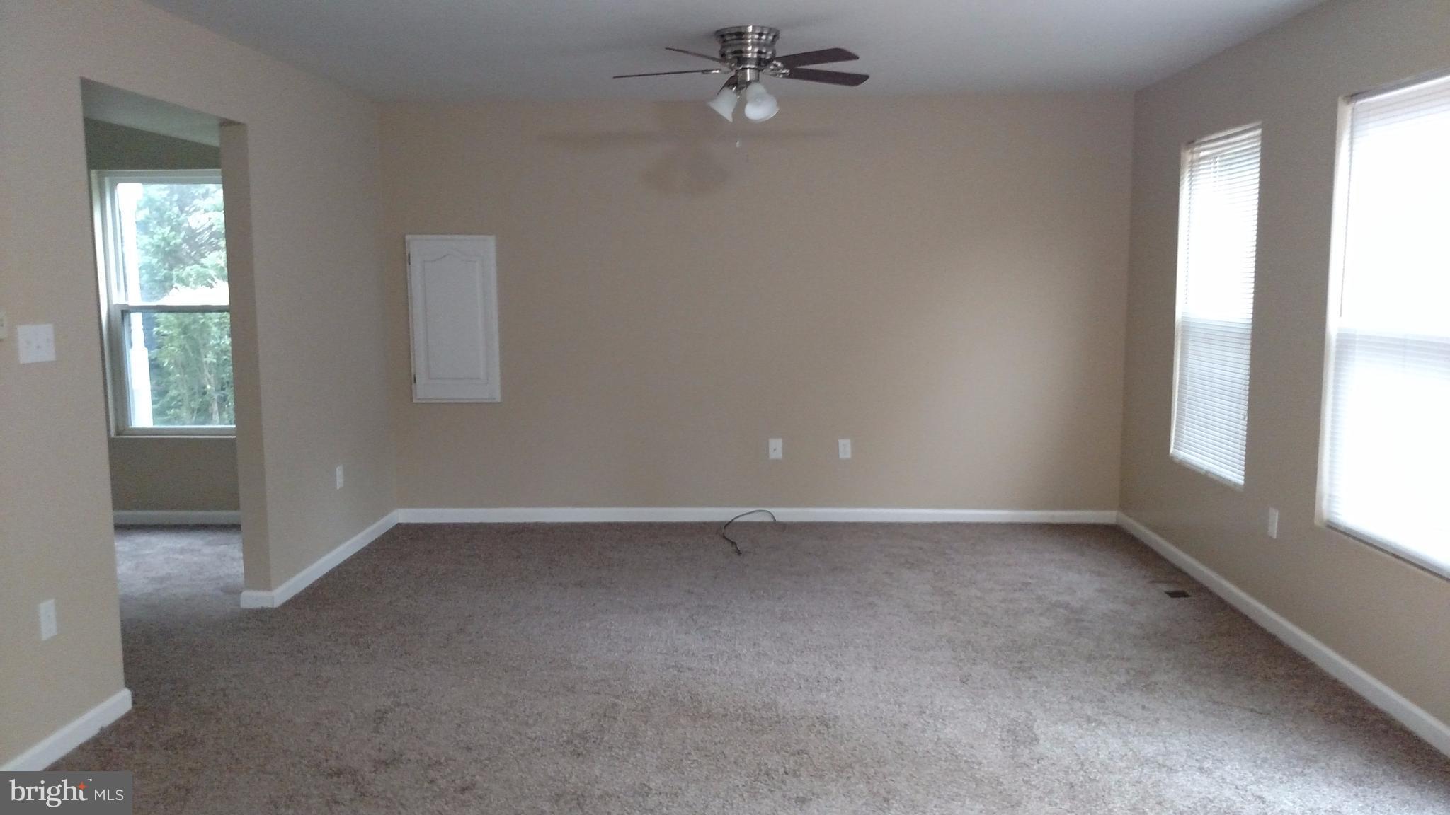 93 Griffith Way Owings, MD 20736 - Photo 6 of 22 an empty room with windows