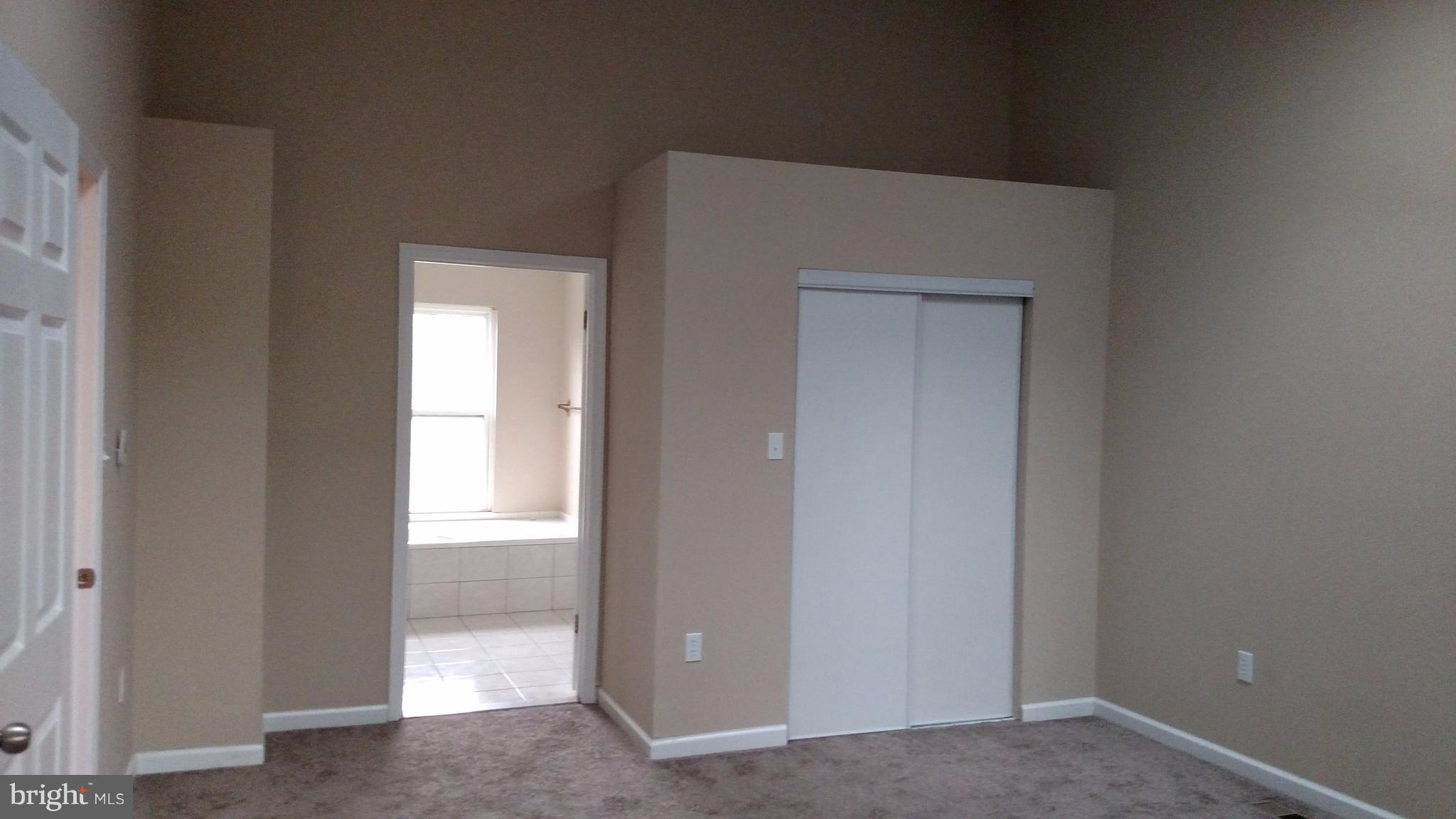 93 Griffith Way Owings, MD 20736 - Photo 9 of 22 a view of an empty room and closet area