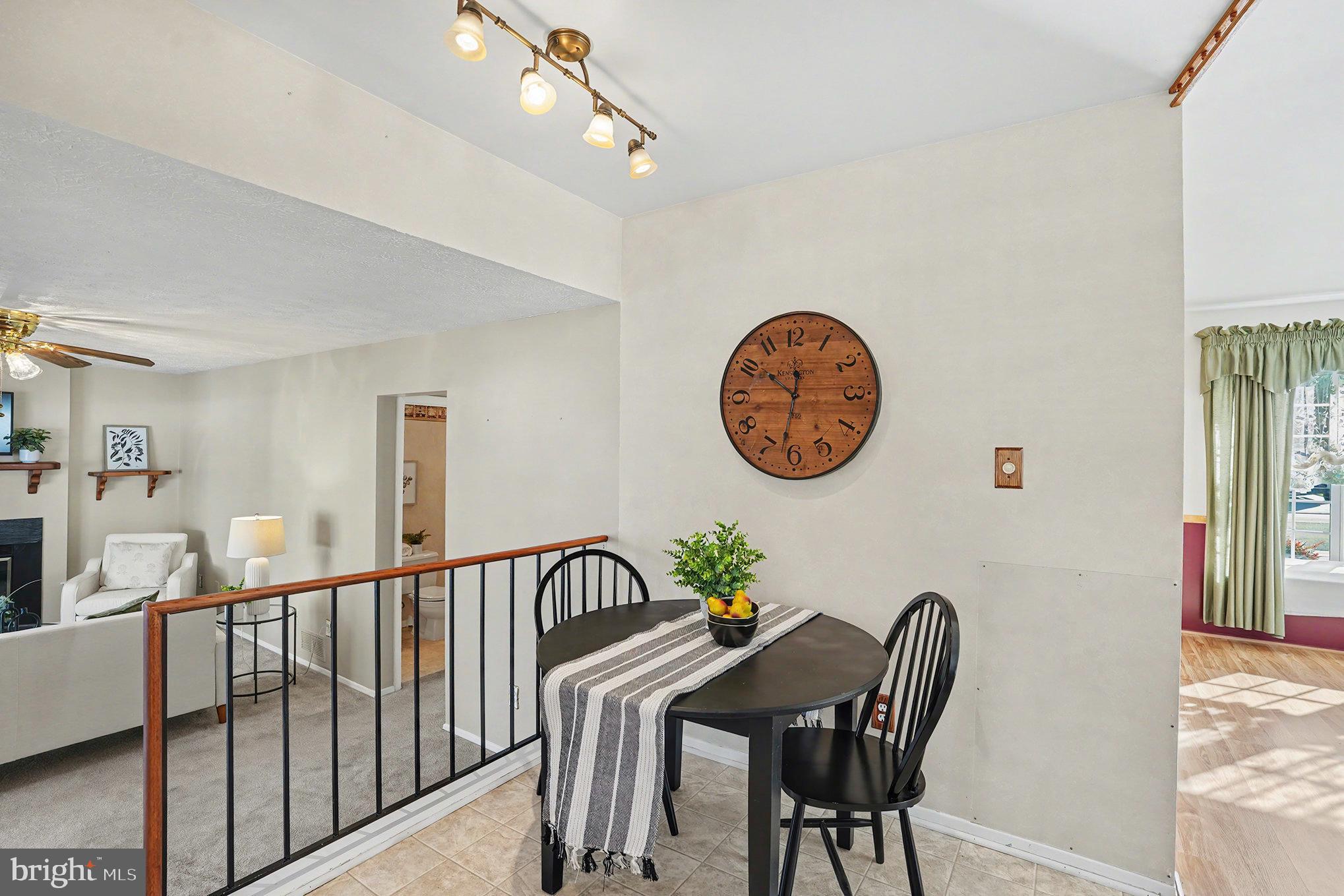 7114 Oliver Beach Road Baltimore, MD 21220 - Photo 12 of 49 a view of a dining room with furniture and a chandelier