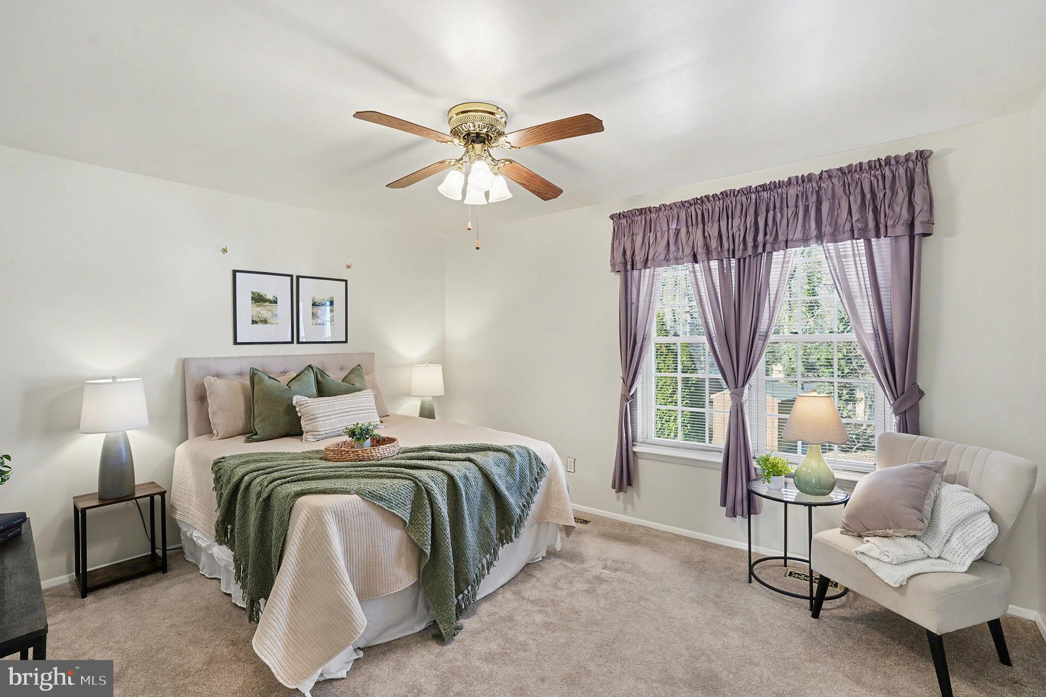 7114 Oliver Beach Road Baltimore, MD 21220 - Photo 18 of 49 a bedroom with a bed and a couch