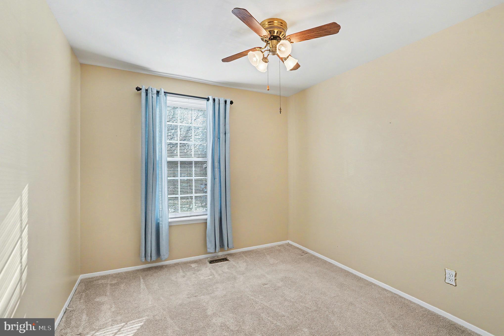 7114 Oliver Beach Road Baltimore, MD 21220 - Photo 23 of 49 a view of an empty room with a window