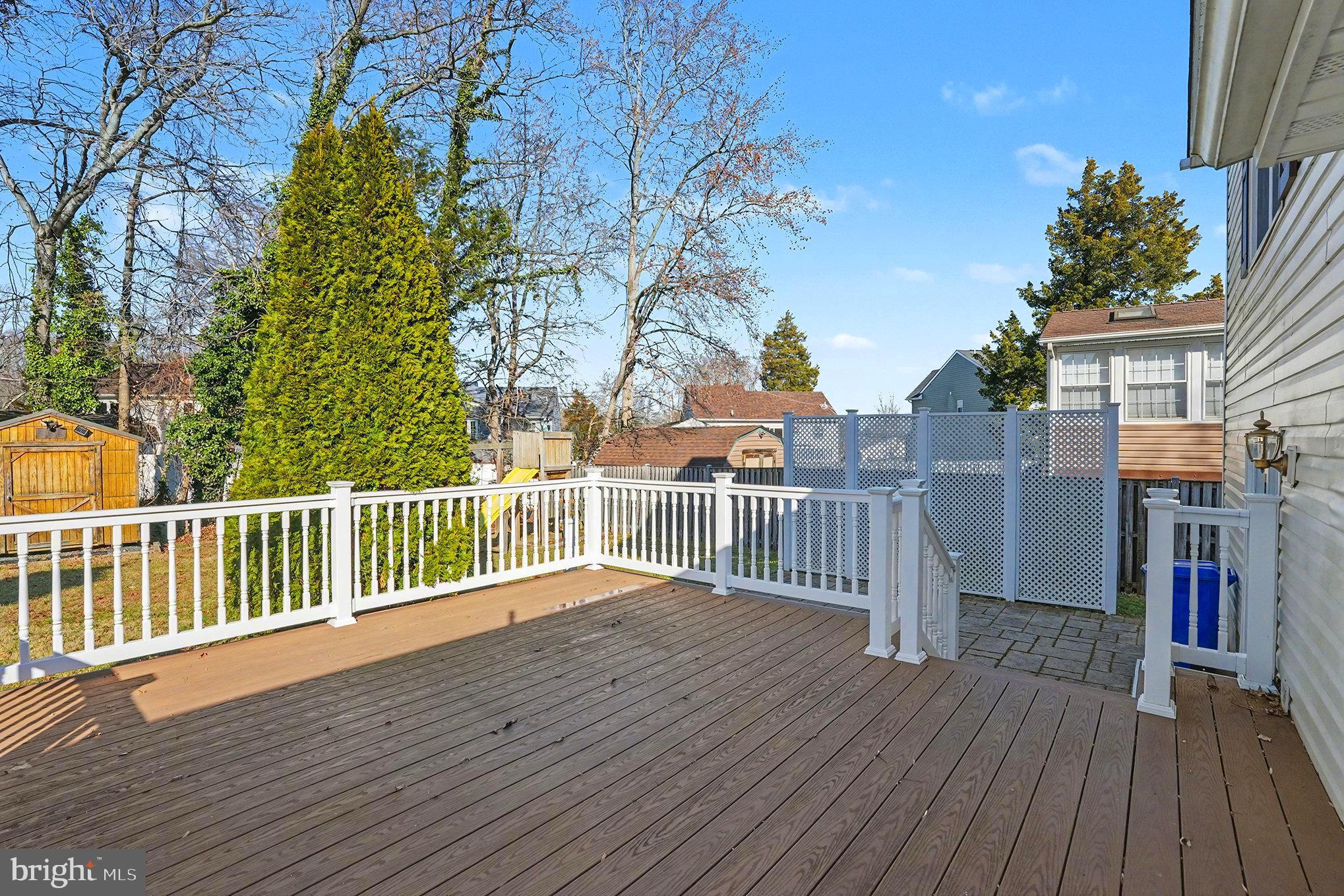 7114 Oliver Beach Road Baltimore, MD 21220 - Photo 27 of 49 a balcony with wooden floor and fence
