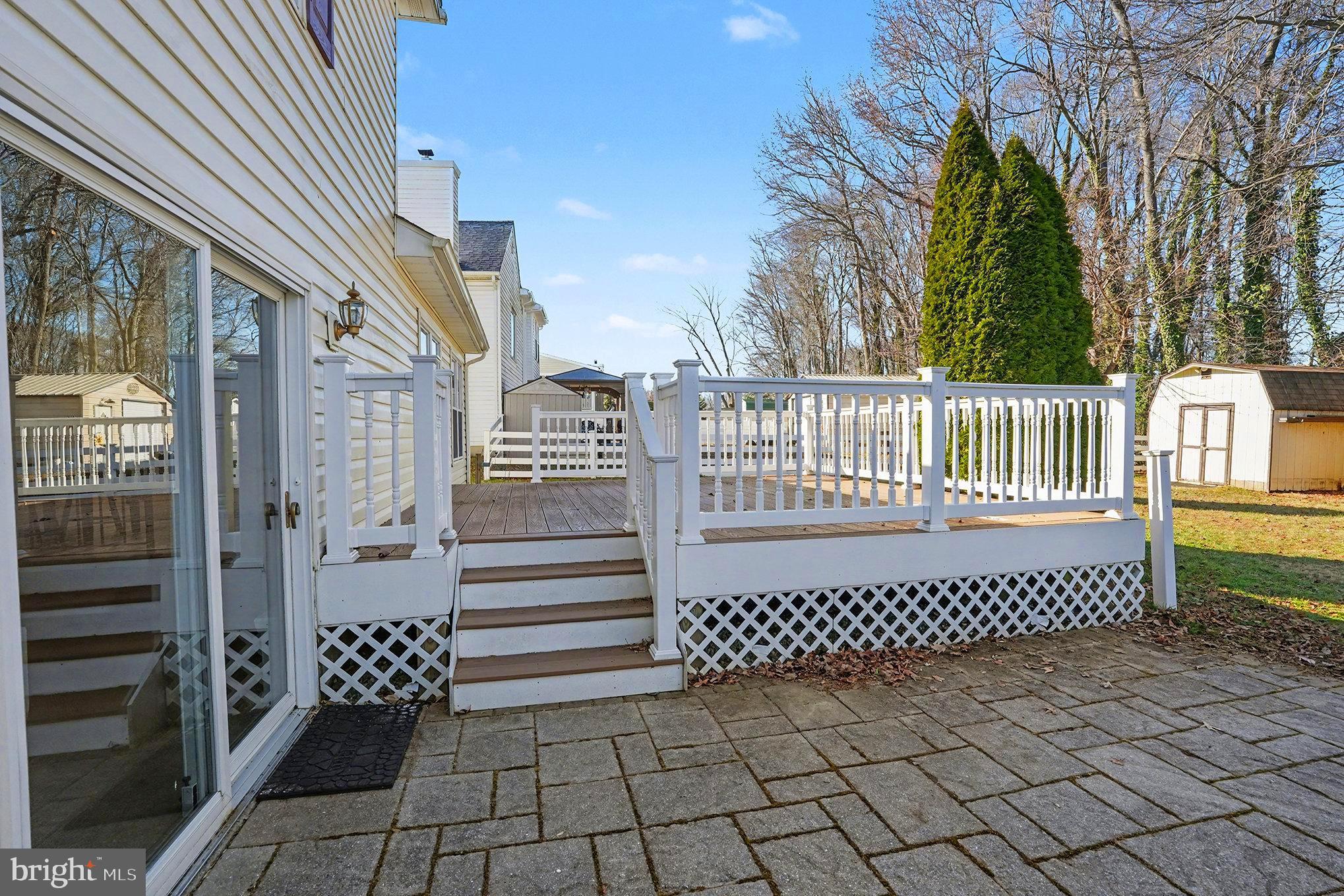 7114 Oliver Beach Road Baltimore, MD 21220 - Photo 28 of 49 a view of a brick house with a bench in wooden floor