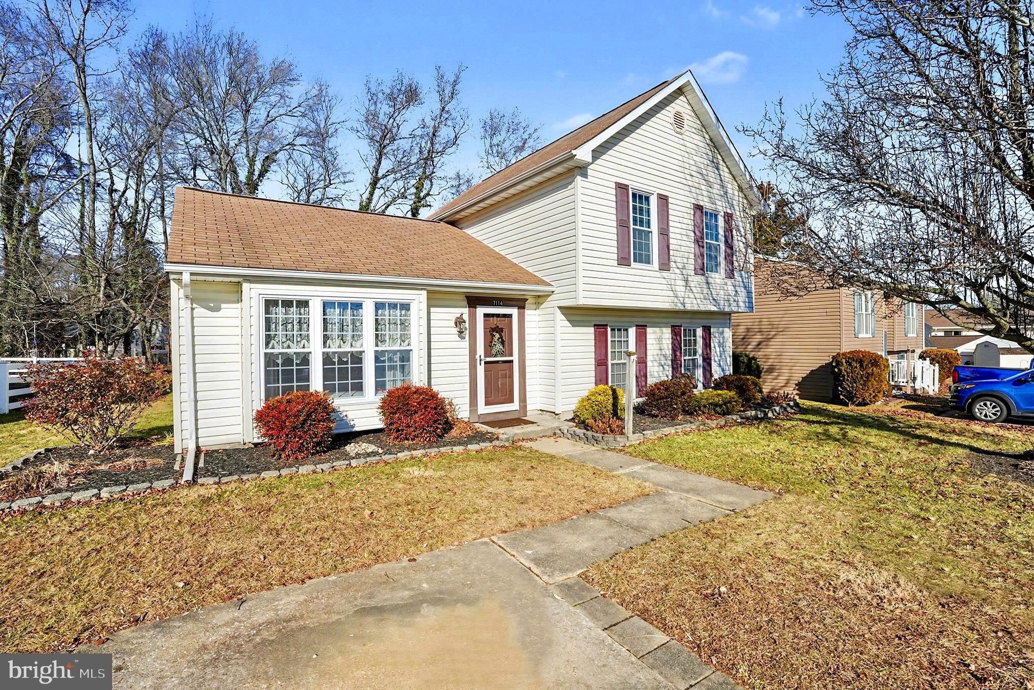 7114 Oliver Beach Road Baltimore, MD 21220 - Photo 3 of 49 a front view of a house with a yard and outdoor seating