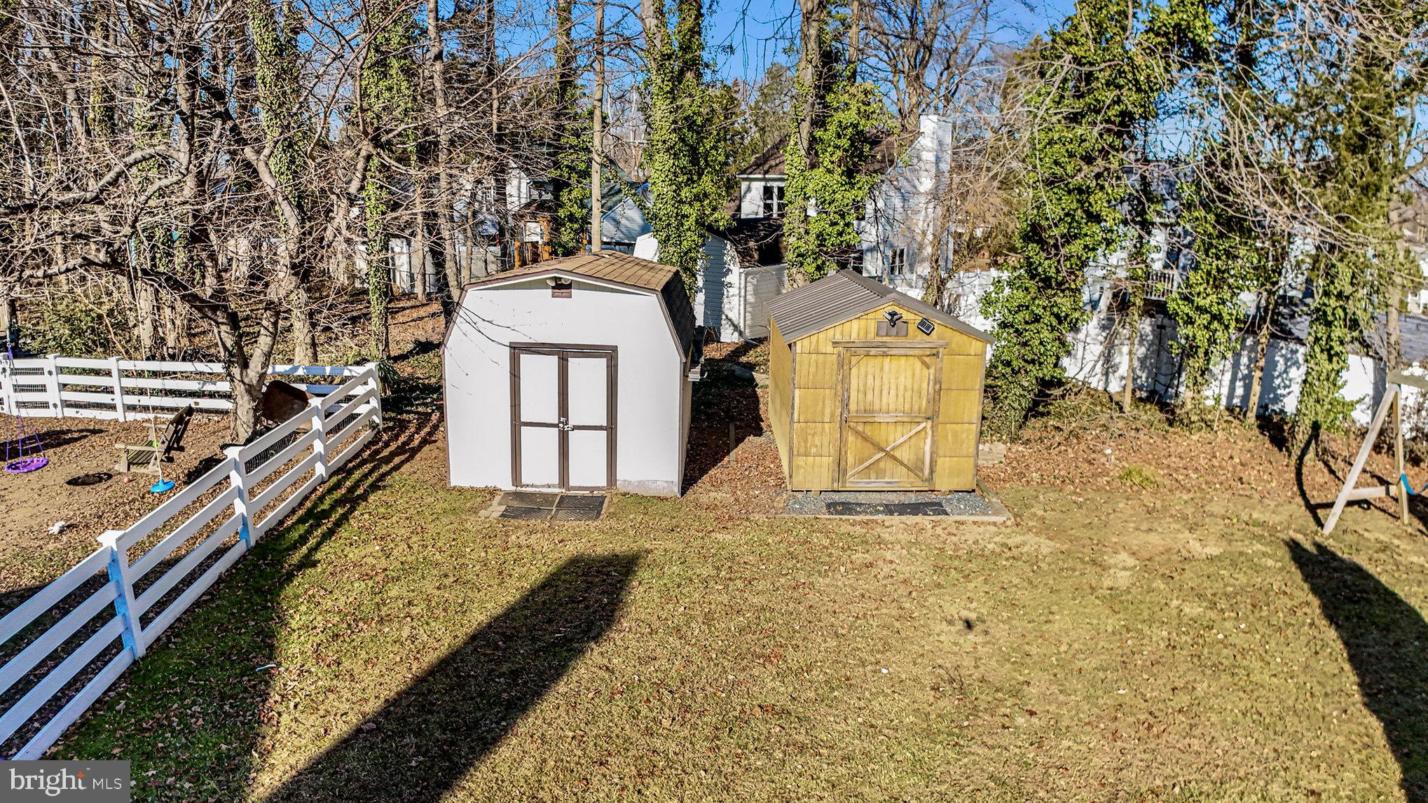 7114 Oliver Beach Road Baltimore, MD 21220 - Photo 33 of 49 a view of a yard with wooden fence and a bench