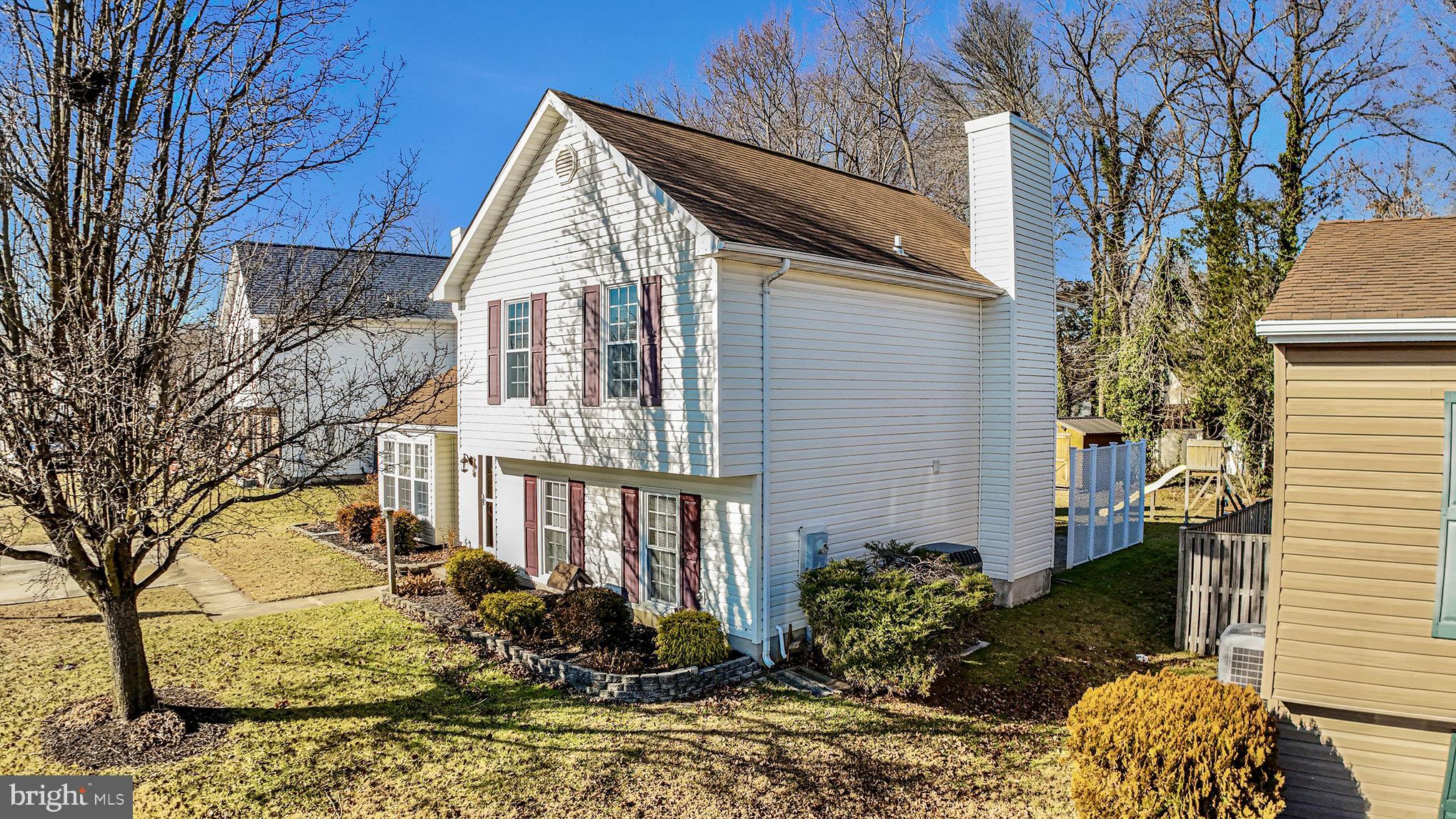 7114 Oliver Beach Road Baltimore, MD 21220 - Photo 4 of 49 a view of a house with a yard and wooden fence