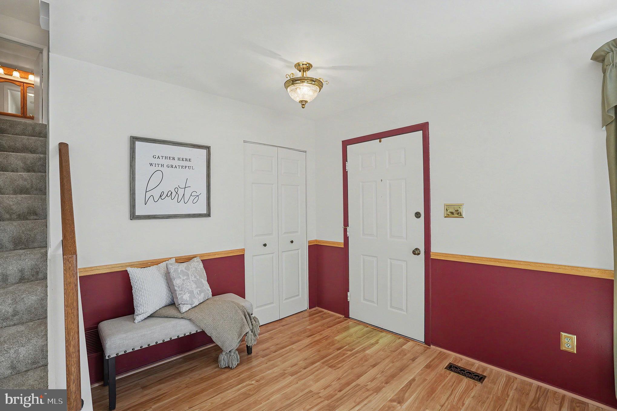 7114 Oliver Beach Road Baltimore, MD 21220 - Photo 8 of 49 a bedroom with furniture and a window