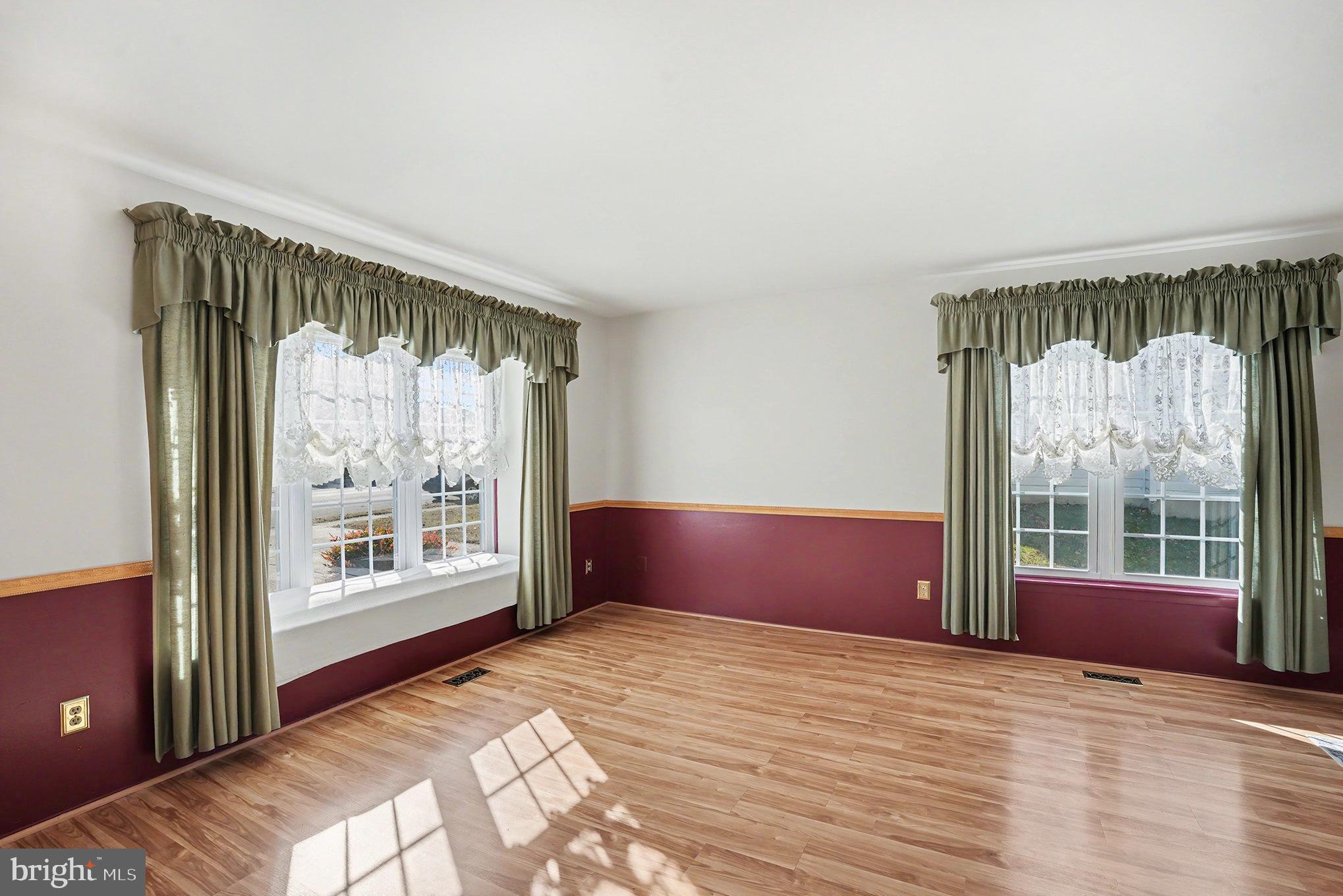 7114 Oliver Beach Road Baltimore, MD 21220 - Photo 9 of 49 a bedroom with a bed and a window