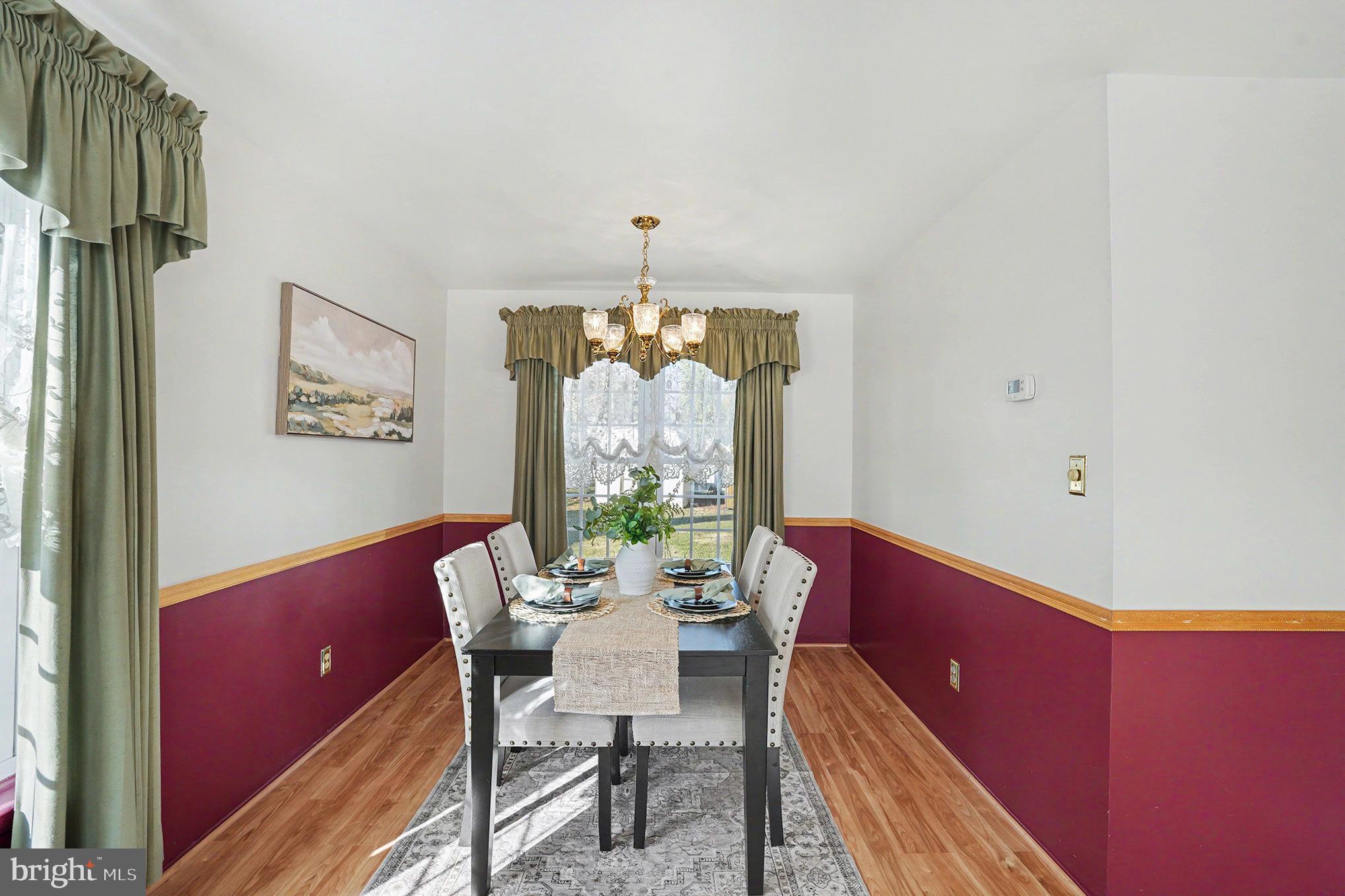 7114 Oliver Beach Road Baltimore, MD 21220 - Photo 10 of 49 a view of a dining room with furniture window and outside view