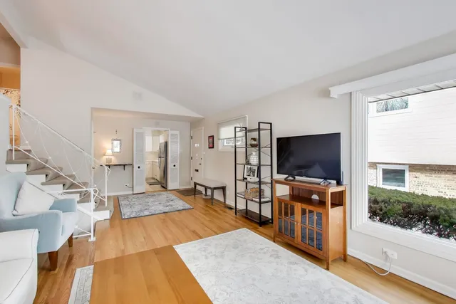 a view of a livingroom with furniture and a flat screen tv