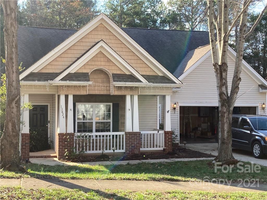13824 Hastings Farm Road Huntersville, NC 28078 - Photo 2 of 14 a view of a house with a small yard plants and large tree