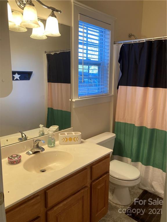 13824 Hastings Farm Road Huntersville, NC 28078 - Photo 11 of 14 a bathroom with a sink toilet and shower