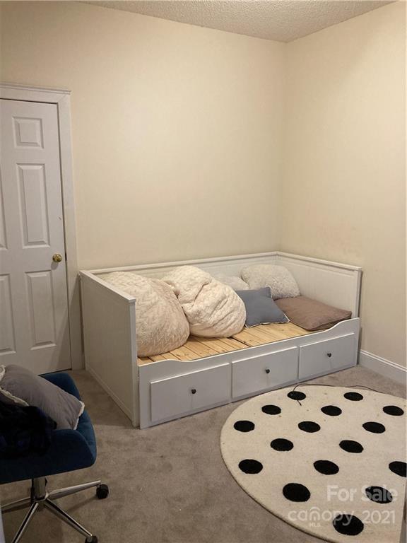 13824 Hastings Farm Road Huntersville, NC 28078 - Photo 12 of 14 a room with a couch