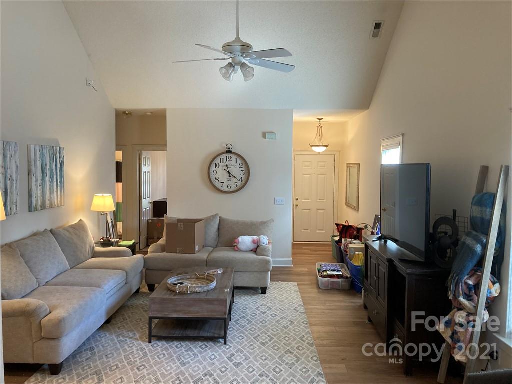 13824 Hastings Farm Road Huntersville, NC 28078 - Photo 3 of 14 a living room with furniture a rug and a window