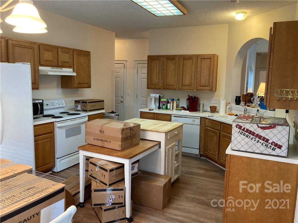 13824 Hastings Farm Road Huntersville, NC 28078 - Photo 6 of 14 a kitchen with a sink appliances and cabinets