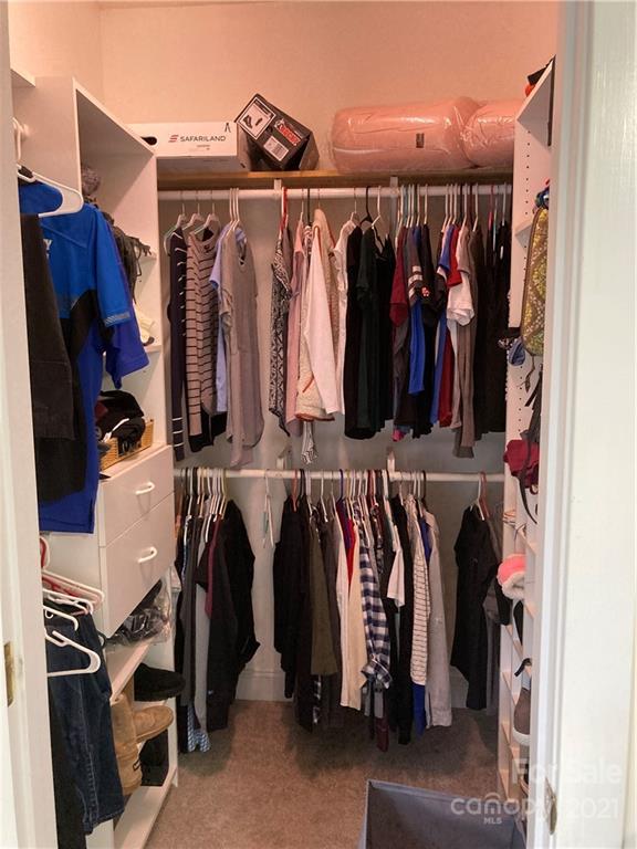 13824 Hastings Farm Road Huntersville, NC 28078 - Photo 9 of 14 a view of walk in closet with clothes and shoes