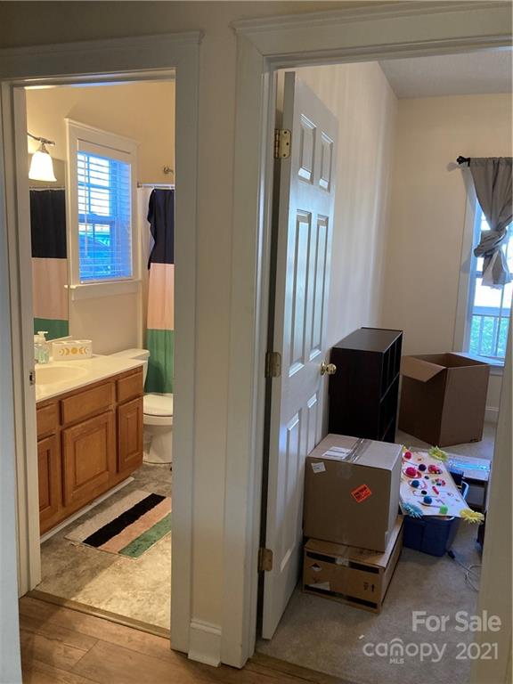 13824 Hastings Farm Road Huntersville, NC 28078 - Photo 10 of 14 a bedroom with furniture and a mirror