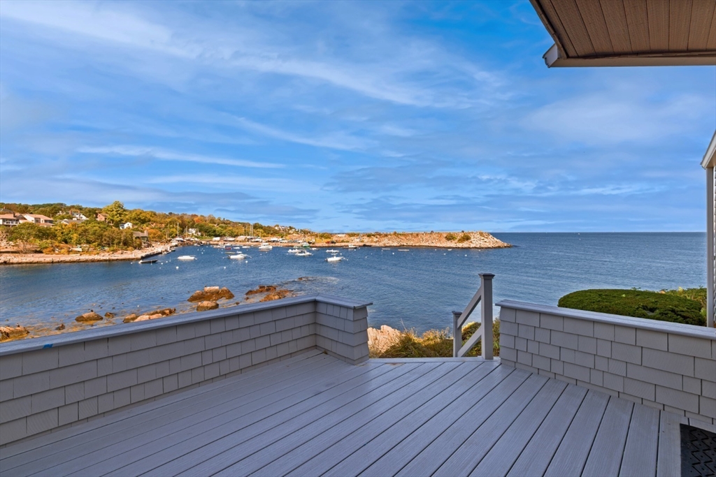 a view of a terrace with wooden floor and a lake view