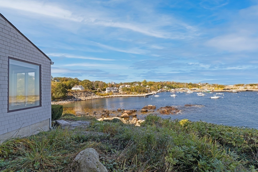 13 Rowe Point, Unit 13 Rockport, MA 01966 - Photo 20 of 27 a view of a lake with a yard