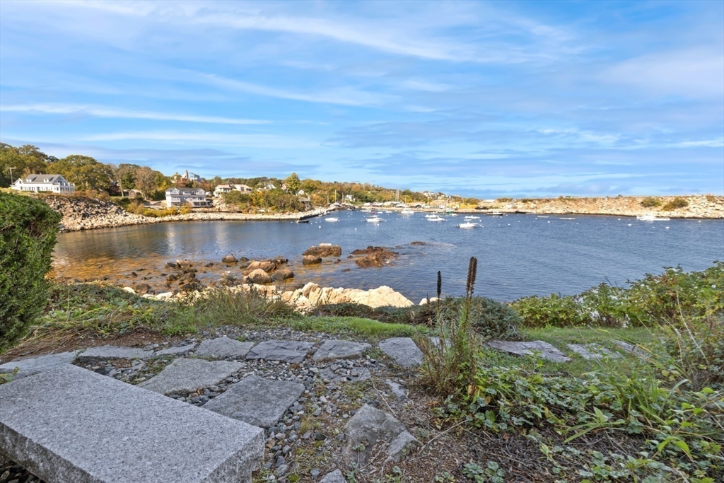 13 Rowe Point, Unit 13 Rockport, MA 01966 - Photo 21 of 27 a view of a lake with houses in the back