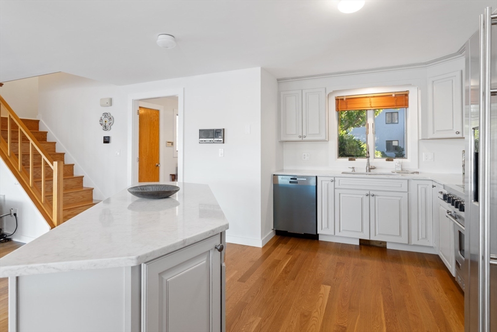 13 Rowe Point, Unit 13 Rockport, MA 01966 - Photo 6 of 27 a kitchen with a sink cabinets and wooden floor