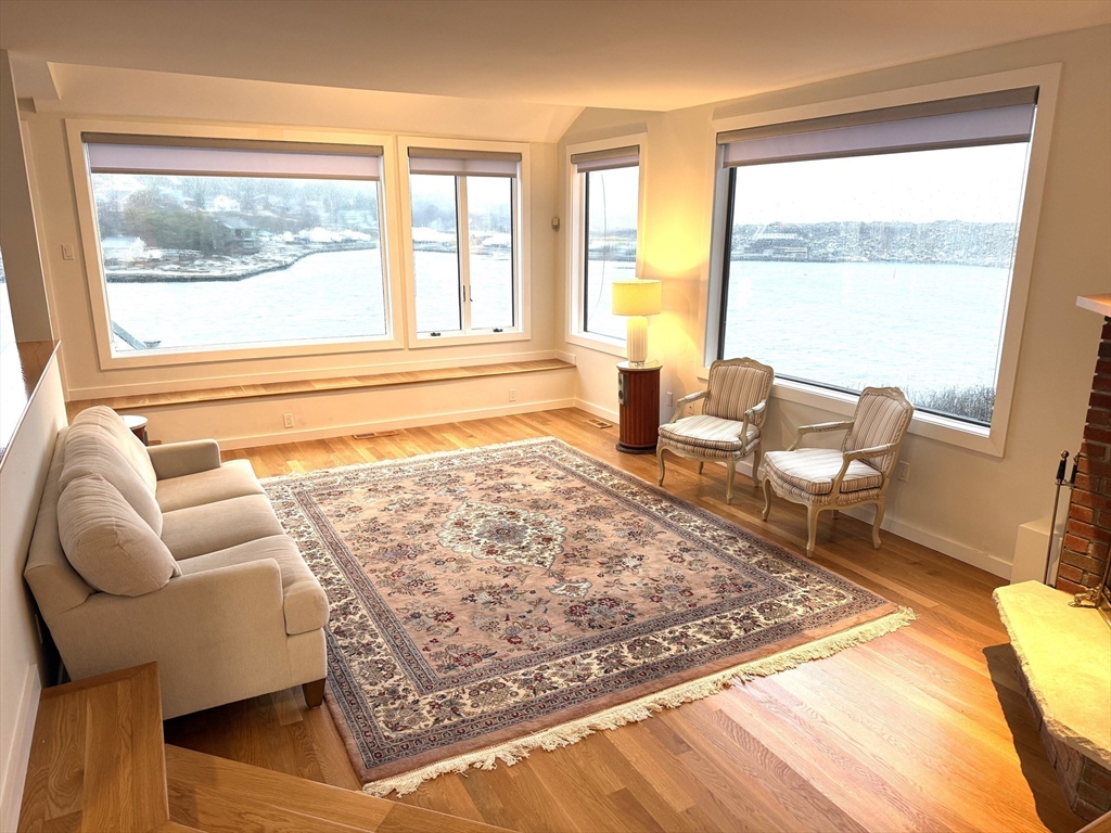 13 Rowe Point, Unit 13 Rockport, MA 01966 - Photo 7 of 27 a living room with furniture and a window