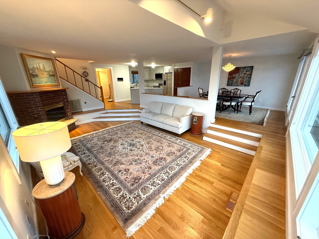 13 Rowe Point, Unit 13 Rockport, MA 01966 - Photo 8 of 27 a living room with couch and a rug