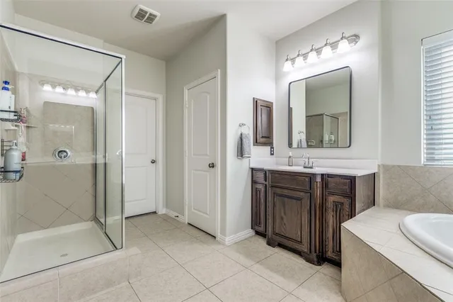 a bathroom with a sink double vanity and a mirror