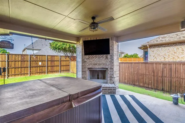 a view of a backyard with a patio and a garden