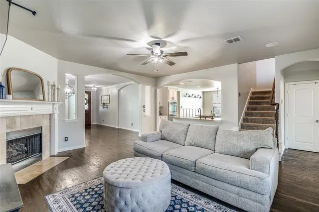a living room with furniture and a fireplace