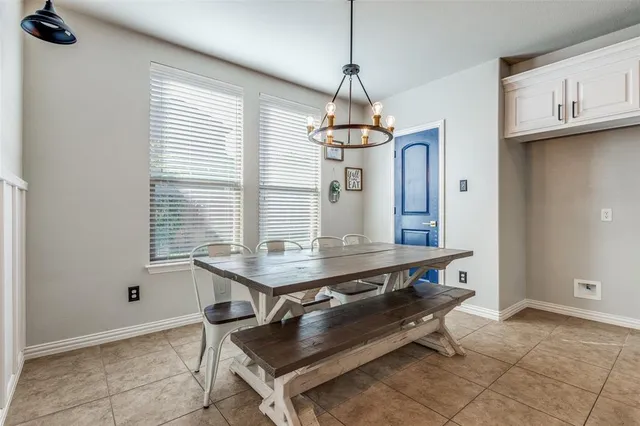 a room with chandelier furniture and window