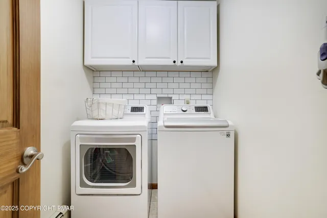 a bathroom with a sink vanity mirror and toilet