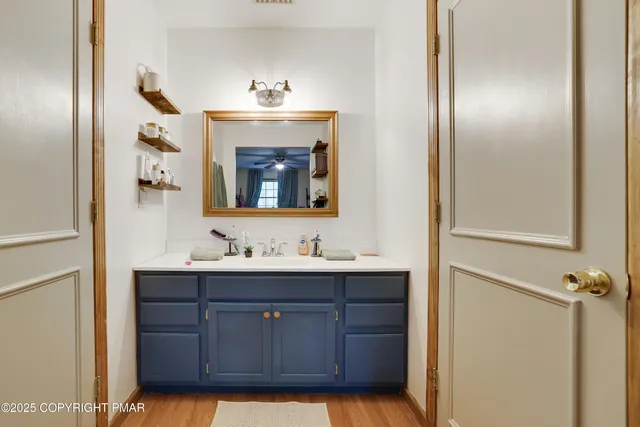 a view of a wooden deck with chairs and a yard