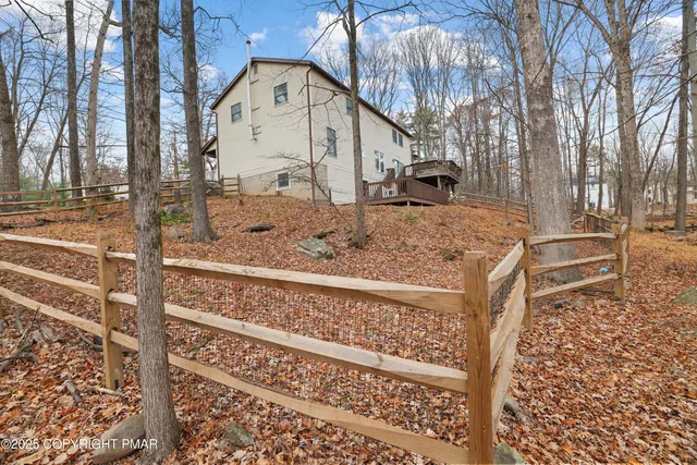 a house with trees in the background