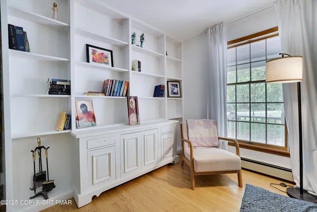 a view of a dining room with furniture window and wooden floor