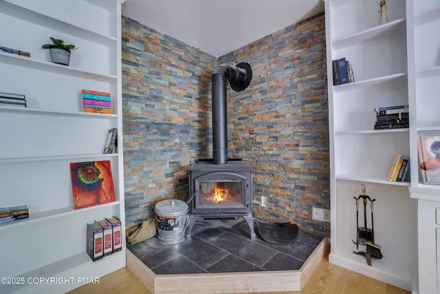 a kitchen with refrigerator and cabinets