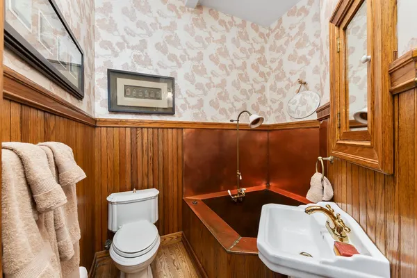 a living room with furniture a rug and a large window