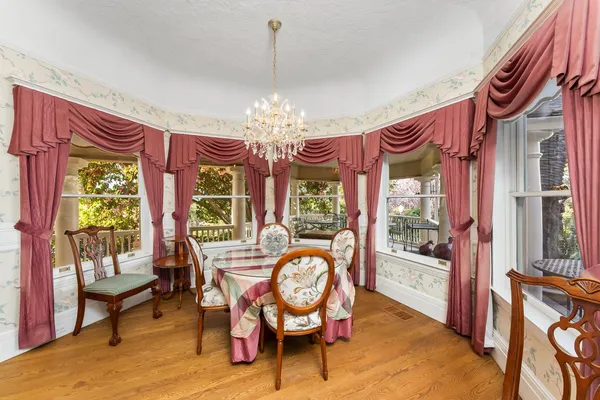 a view of a balcony with a yard