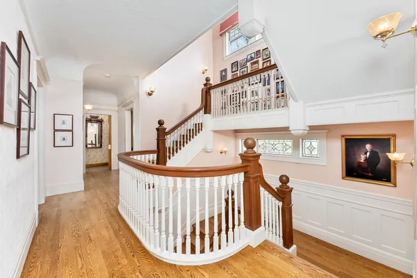 a bedroom with bed and a chandelier