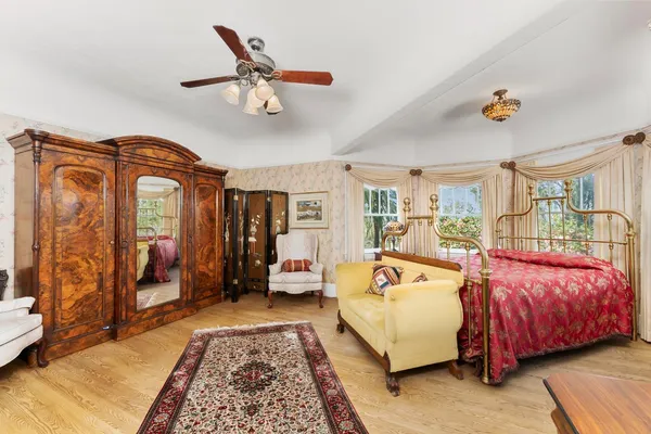 a bedroom with a bed and a dresser