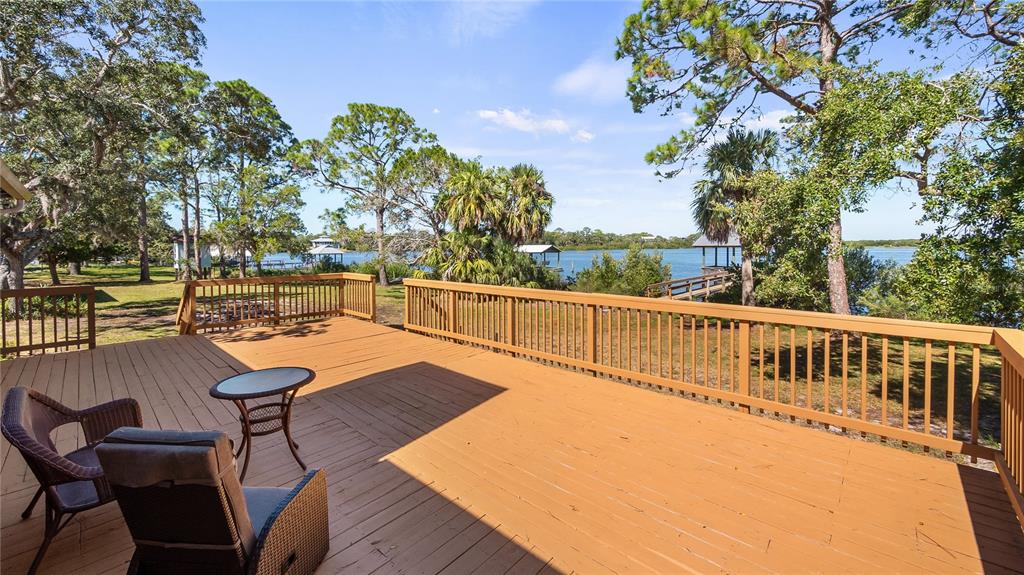 16317 Andrews Circle Cedar Key, FL 32625 - Photo 15 of 53 a view of swimming pool with seating area and trees around