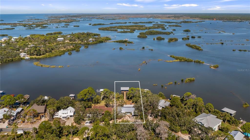 16317 Andrews Circle Cedar Key, FL 32625 - Photo 2 of 53 an aerial view of ocean and residential houses with outdoor space
