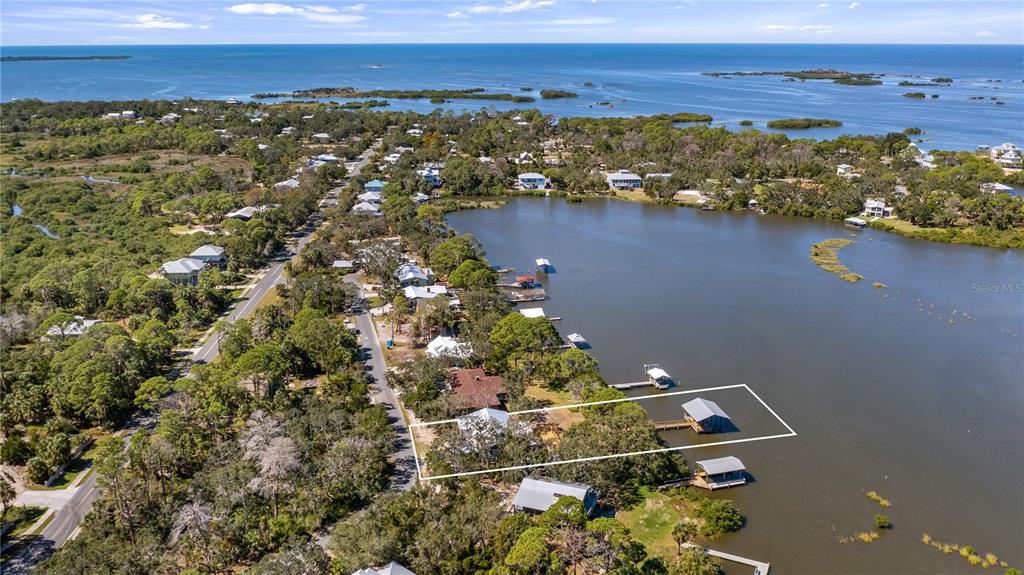16317 Andrews Circle Cedar Key, FL 32625 - Photo 3 of 53 an aerial view of residential building with outdoor space