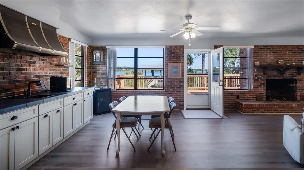 16317 Andrews Circle Cedar Key, FL 32625 - Photo 34 of 53 a kitchen with stainless steel appliances granite countertop a stove refrigerator and a fireplace