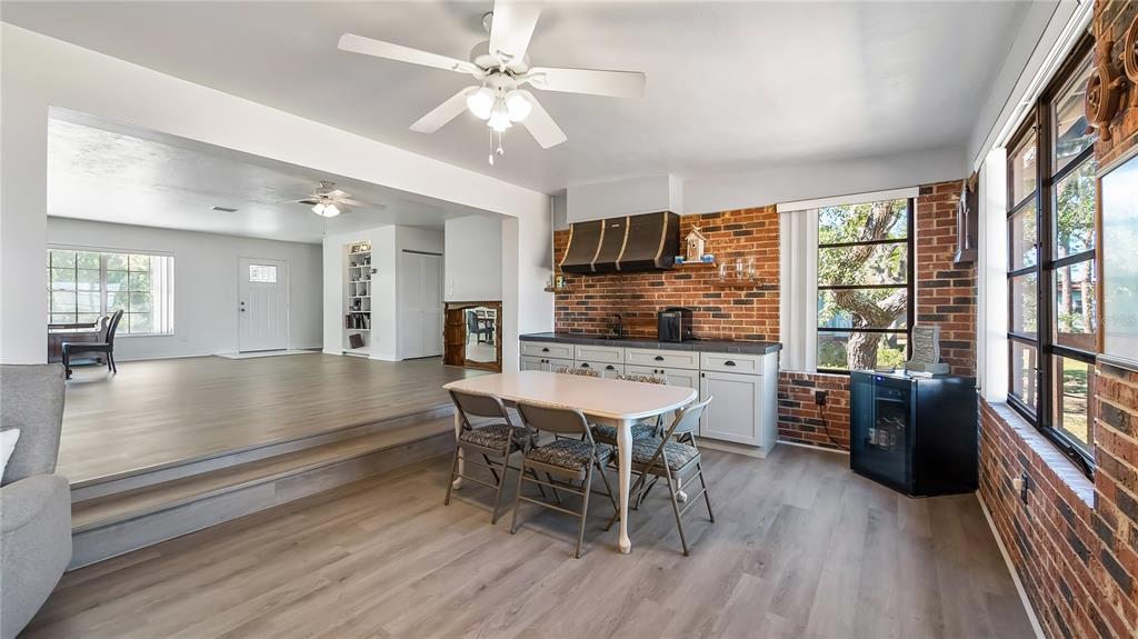 16317 Andrews Circle Cedar Key, FL 32625 - Photo 44 of 53 a view of a dining room with furniture window and wooden floor